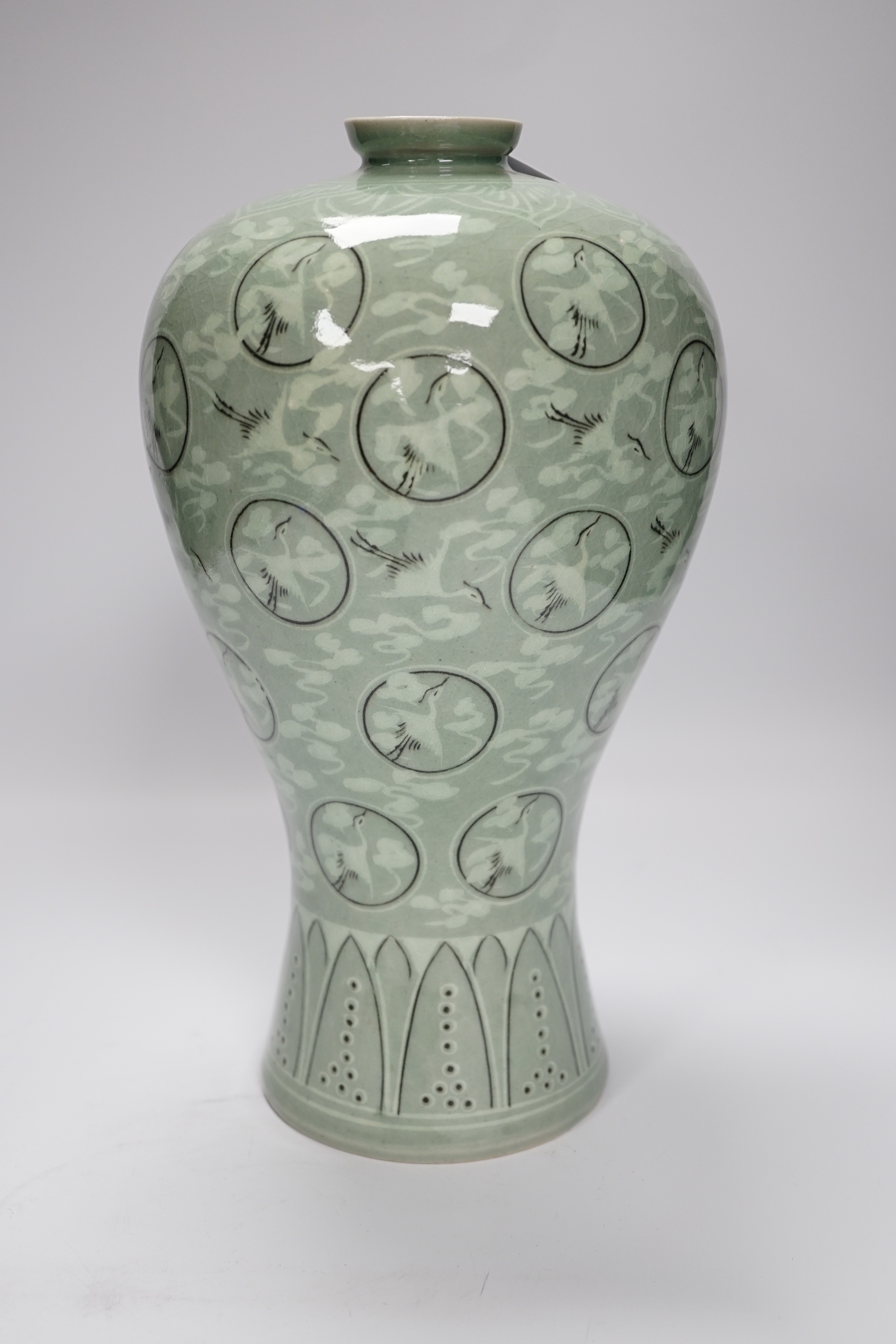 A Chinese blue and white seal paste box, and a Korean celadon vase decorated with cranes, 33cm high